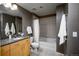 This bathroom features a granite topped vanity and a shower-tub combination at 1700 Bassett St # 1119, Denver, CO 80202