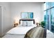 Cozy bedroom features stylish decor and plenty of natural light at 1700 Bassett St # 1119, Denver, CO 80202