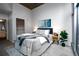 Sunlit primary bedroom featuring plush bedding, stylish decor, and a serene atmosphere at 1700 Bassett St # 1119, Denver, CO 80202