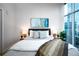Serene primary bedroom featuring plush bedding, stylish decor, and bright natural light at 1700 Bassett St # 1119, Denver, CO 80202