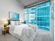 Serene bedroom featuring a large window with excellent city views at 1700 Bassett St # 1119, Denver, CO 80202