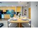 Stylish dining area adjacent to the kitchen with modern furnishings at 1700 Bassett St # 1119, Denver, CO 80202