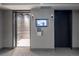 Interior elevator with TV screen on the wall at 1700 Bassett St # 1119, Denver, CO 80202