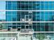 High-rise condo building with reflective glass and private balconies at 1700 Bassett St # 1119, Denver, CO 80202