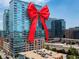 Modern high rise with a red bow on the building at 1700 Bassett St # 1119, Denver, CO 80202