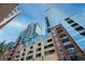 Stunning low angle view of a modern high rise with brick and glass exterior at 1700 Bassett St # 1119, Denver, CO 80202