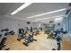 Clean and well-equipped gym featuring modern stationary bikes and ample natural light from large windows at 1700 Bassett St # 1119, Denver, CO 80202