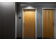 Hallway with wooden doors and textured walls at 1700 Bassett St # 1119, Denver, CO 80202