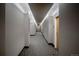 Well-lit hallway with modern carpet and neutral paint at 1700 Bassett St # 1119, Denver, CO 80202