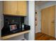 Cozy home office featuring built-in desk with a black countertop and stylish black subway tile backsplash at 1700 Bassett St # 1119, Denver, CO 80202