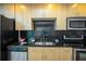 Close-up of modern kitchen with stainless steel appliances and sleek countertops at 1700 Bassett St # 1119, Denver, CO 80202