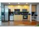 Updated kitchen with stainless steel appliances, hardwood floors, and plenty of cabinet space at 1700 Bassett St # 1119, Denver, CO 80202