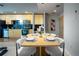 Modern kitchen and dining area with updated appliances, sleek cabinets, and stylish table at 1700 Bassett St # 1119, Denver, CO 80202