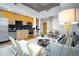 Open-concept living area with a modern kitchen, dining, and sitting area at 1700 Bassett St # 1119, Denver, CO 80202