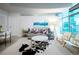 Bright living room with city views through expansive windows at 1700 Bassett St # 1119, Denver, CO 80202