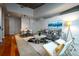 Open-concept living area featuring hardwood floors, chic decor, and great natural light at 1700 Bassett St # 1119, Denver, CO 80202