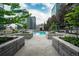 Inviting pool deck surrounded by plants and trees, perfect for relaxing and lounging at 1700 Bassett St # 1119, Denver, CO 80202