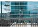 View from condo balcony overlooking a rooftop garden and modern glass high rise at 1700 Bassett St # 1119, Denver, CO 80202