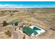 Aerial view of community clubhouse and pool with beautiful landscaping, offering a great amenity for residents at 6214 Long Branch Dr, Parker, CO 80134