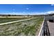 A serene backyard view showcases open space and walking trails, providing a peaceful outdoor experience at 6214 Long Branch Dr, Parker, CO 80134