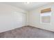 Cozy bedroom with closet and natural light through a window with a shade at 6214 Long Branch Dr, Parker, CO 80134