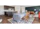 Open-concept living space featuring kitchen, dining area, and seating, with stylish decor and ample natural light at 6214 Long Branch Dr, Parker, CO 80134