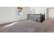 Spacious loft area with neutral carpet and natural light perfect for a play area or sitting room at 6214 Long Branch Dr, Parker, CO 80134