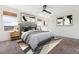 Comfortable main bedroom with stylish decor, neutral carpet, ample natural light, and a modern ceiling fan at 6214 Long Branch Dr, Parker, CO 80134