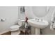 Small bathroom with pedestal sink and toilet at 45 Jackson St # A, Denver, CO 80206