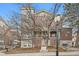 Three-story brick building with unique architectural details and landscaping at 45 Jackson St # A, Denver, CO 80206