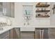 Kitchen features white subway tile and a farmhouse sink at 45 Jackson St # A, Denver, CO 80206