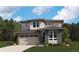 Beautiful two-story home featuring stone accents, neutral siding, large windows and an attached two-car garage at 498 S Rifle St, Aurora, CO 80017