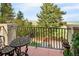 Outdoor balcony area with wrought iron furniture and scenic views of the surrounding landscape at 8932 Eastridge Rd, Golden, CO 80403