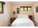 Cozy bedroom featuring two side tables and windows with natural light at 8932 Eastridge Rd, Golden, CO 80403