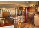 Spacious kitchen features stainless steel appliances, a center island, and adjacent dining area at 8932 Eastridge Rd, Golden, CO 80403