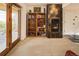 Living area showcasing a fireplace, shelving, and a seamless indoor-outdoor transition at 8932 Eastridge Rd, Golden, CO 80403