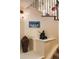 Interior staircase displaying artistic decor, with a sculpture and picture gallery on the walls at 8932 Eastridge Rd, Golden, CO 80403