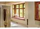 Charming window seat with plush cushions, offering a tranquil space with natural light at 8932 Eastridge Rd, Golden, CO 80403