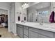 Bright bathroom featuring double sinks, modern fixtures, and a glass-enclosed shower for a luxurious feel at 27853 E 8Th Ave, Aurora, CO 80018