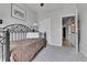 Cozy bedroom with a unique metal bed frame, plush carpet, and ample closet space at 27853 E 8Th Ave, Aurora, CO 80018