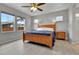 Cozy bedroom featuring natural light, wood floors, and a classic ceiling fan for added comfort and style at 27853 E 8Th Ave, Aurora, CO 80018
