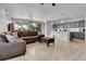 Cozy living room and kitchen combo featuring an open-concept design with natural light at 27853 E 8Th Ave, Aurora, CO 80018