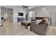 Cozy living room with light hardwood floors, modern decor, and a comfortable seating arrangement at 27853 E 8Th Ave, Aurora, CO 80018