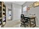 Bright office space featuring a desk, chair, closet and natural light, ideal for working from home at 27853 E 8Th Ave, Aurora, CO 80018