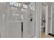 Modern walk-in shower with sleek glass doors, tiled walls, and contemporary fixtures at 27853 E 8Th Ave, Aurora, CO 80018