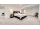 Spacious primary bedroom features neutral decor, soft carpeting, and access to the en suite bathroom at 6894 E 133Rd Pl, Thornton, CO 80602
