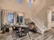Dining room adjacent to a staircase showcasing modern furnishings and decor at 6894 E 133Rd Pl, Thornton, CO 80602