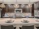 Modern kitchen featuring a center island, stainless steel appliances, and stylish backsplash at 6894 E 133Rd Pl, Thornton, CO 80602