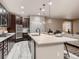 Bright, open kitchen boasts a large island, stainless appliances, and seamless access to living spaces at 6894 E 133Rd Pl, Thornton, CO 80602