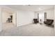 Inviting living room with gray carpet, neutral walls, and comfortable seating area at 6894 E 133Rd Pl, Thornton, CO 80602